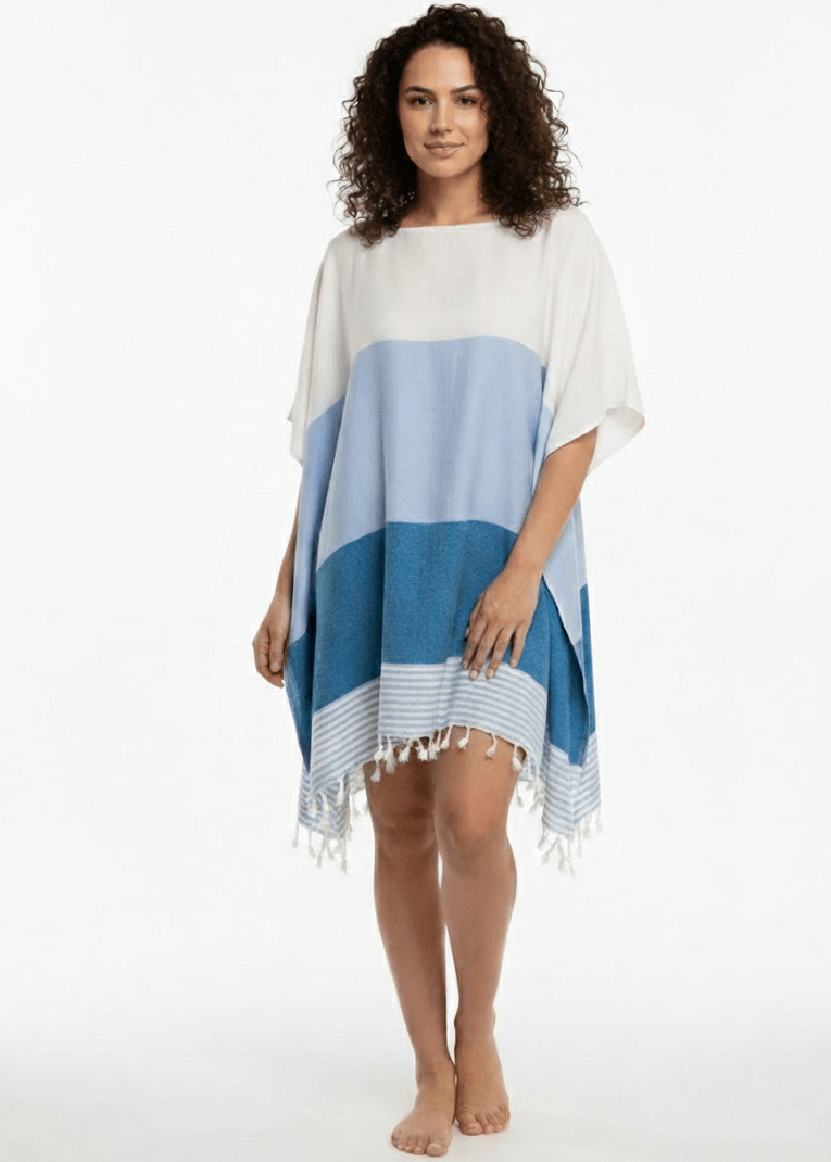 Woman wearing a blue and white striped dress on a white background