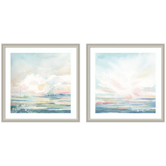 Two framed artworks of a serene landscape with a sunset or sunrise over water on a white background.