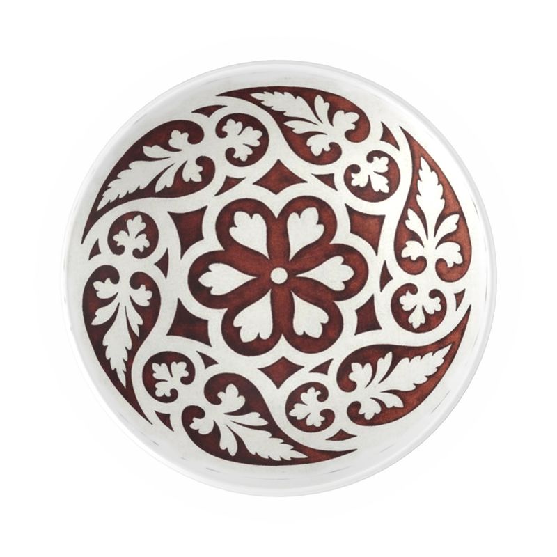 Decorative plate with intricate brown and white floral pattern on a white background