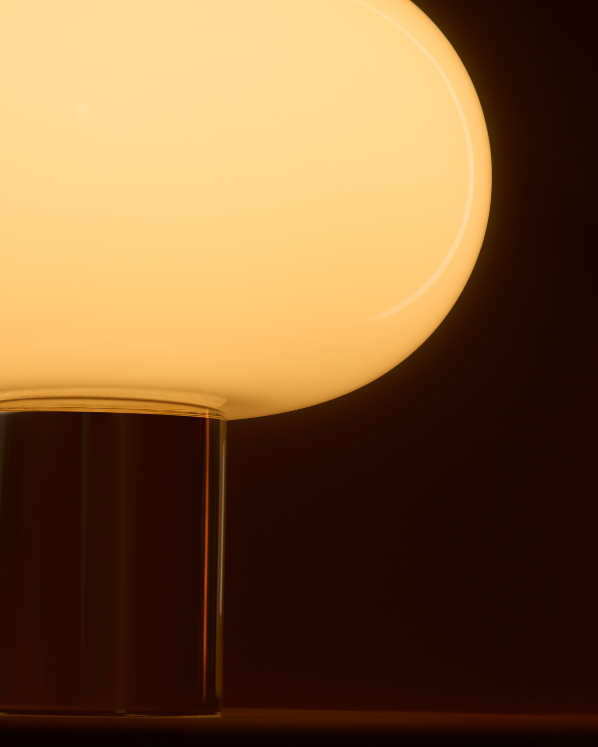 Close-up of a glowing light bulb against a dark background