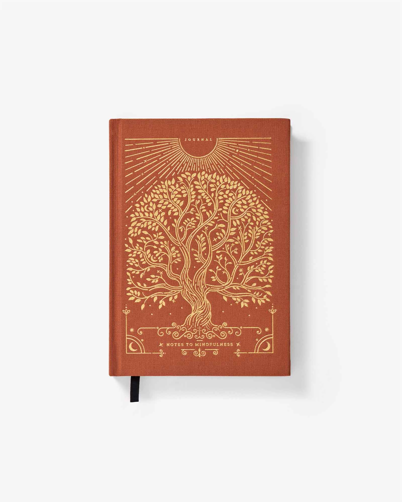 Brown notebook with gold tree design on a white background