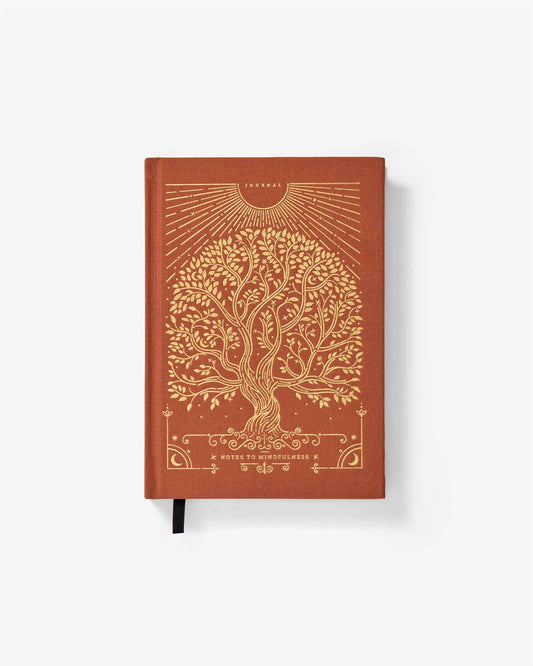 Brown notebook with gold tree design on a white background