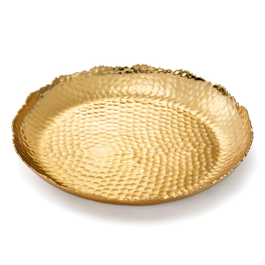 Gold decorative plate with textured surface on a white background