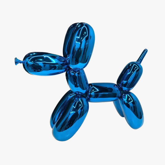 Blue metallic balloon dog sculpture on a white background