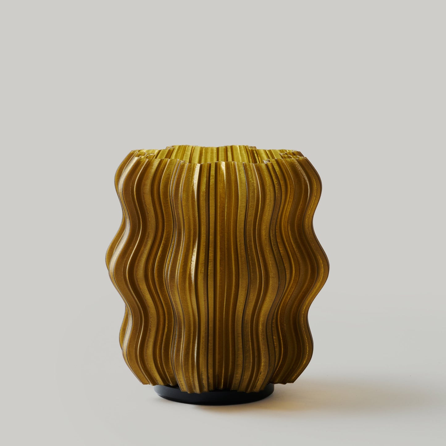 Decorative vase with wavy design on a plain background