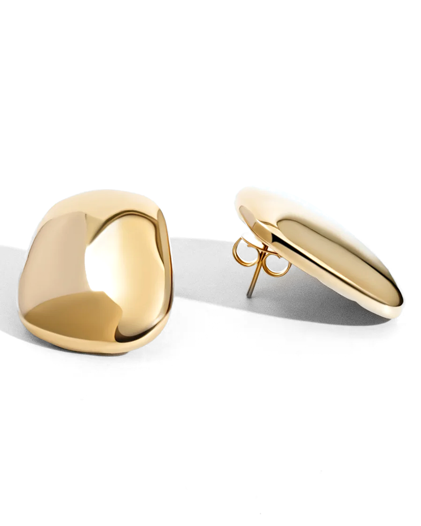 A pair of polished gold-toned stud earrings with a smooth, organic teardrop shape, shown on a clean white background with soft shadows.