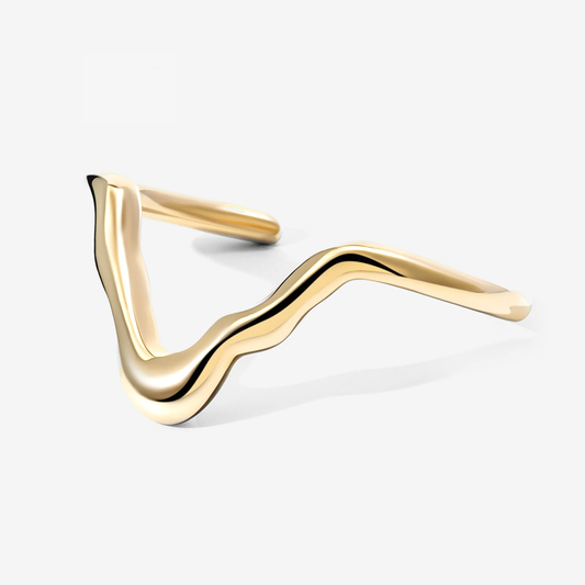 A polished gold wavy cuff ring with a smooth, flowing triangular design, shown on a clean light gray background.