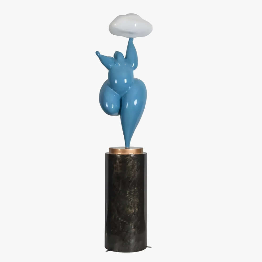 Blue abstract sculpture on a black cylindrical base against a white background