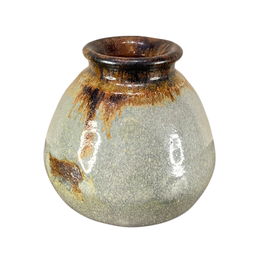 Ceramic vase with brown and beige glaze on a white background