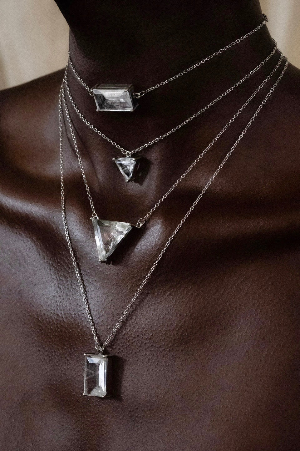 Necklace with geometric pendants on a mannequin
