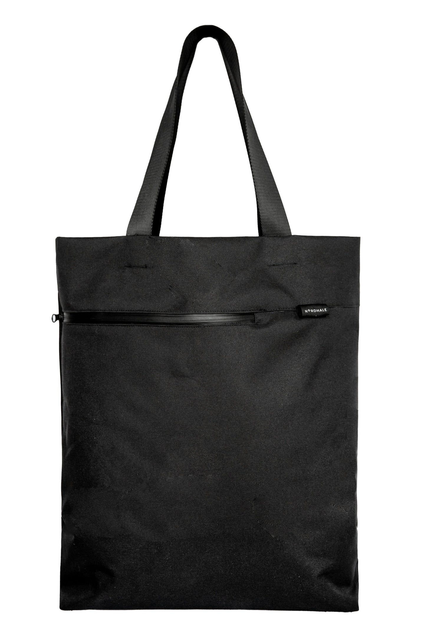 A premium, handmade black water-resistant canvas Nordhale VIK tote bag, featuring Nordic minimalist design and styled as a luxury everyday work bag.