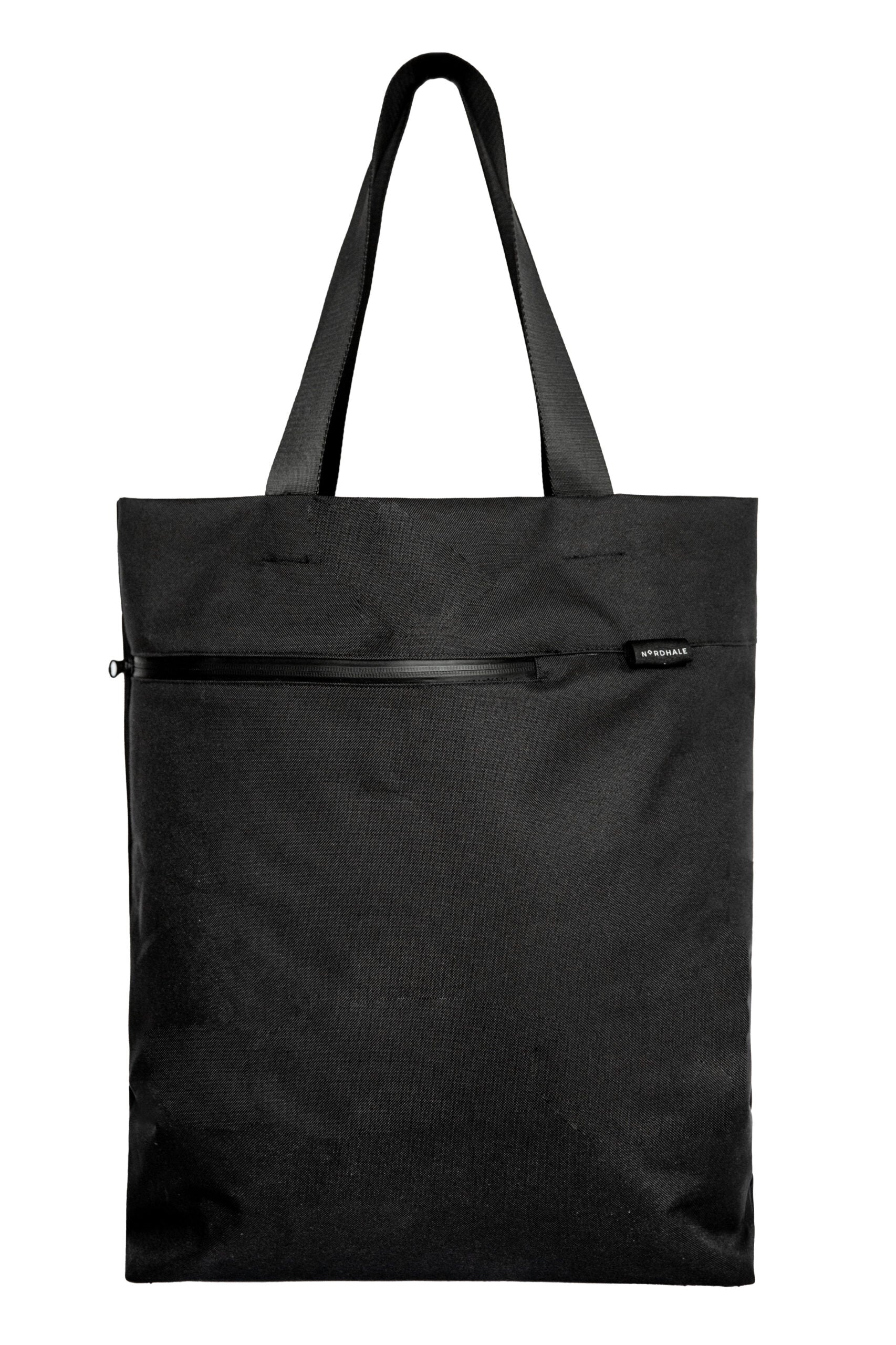 A premium, handmade black water-resistant canvas Nordhale VIK tote bag, featuring Nordic minimalist design and styled as a luxury everyday work bag.