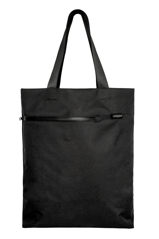 A premium, handmade black water-resistant canvas Nordhale VIK tote bag, featuring Nordic minimalist design and styled as a luxury everyday work bag.