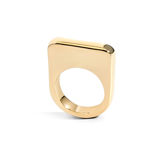 Gold ring with a unique design on a white background