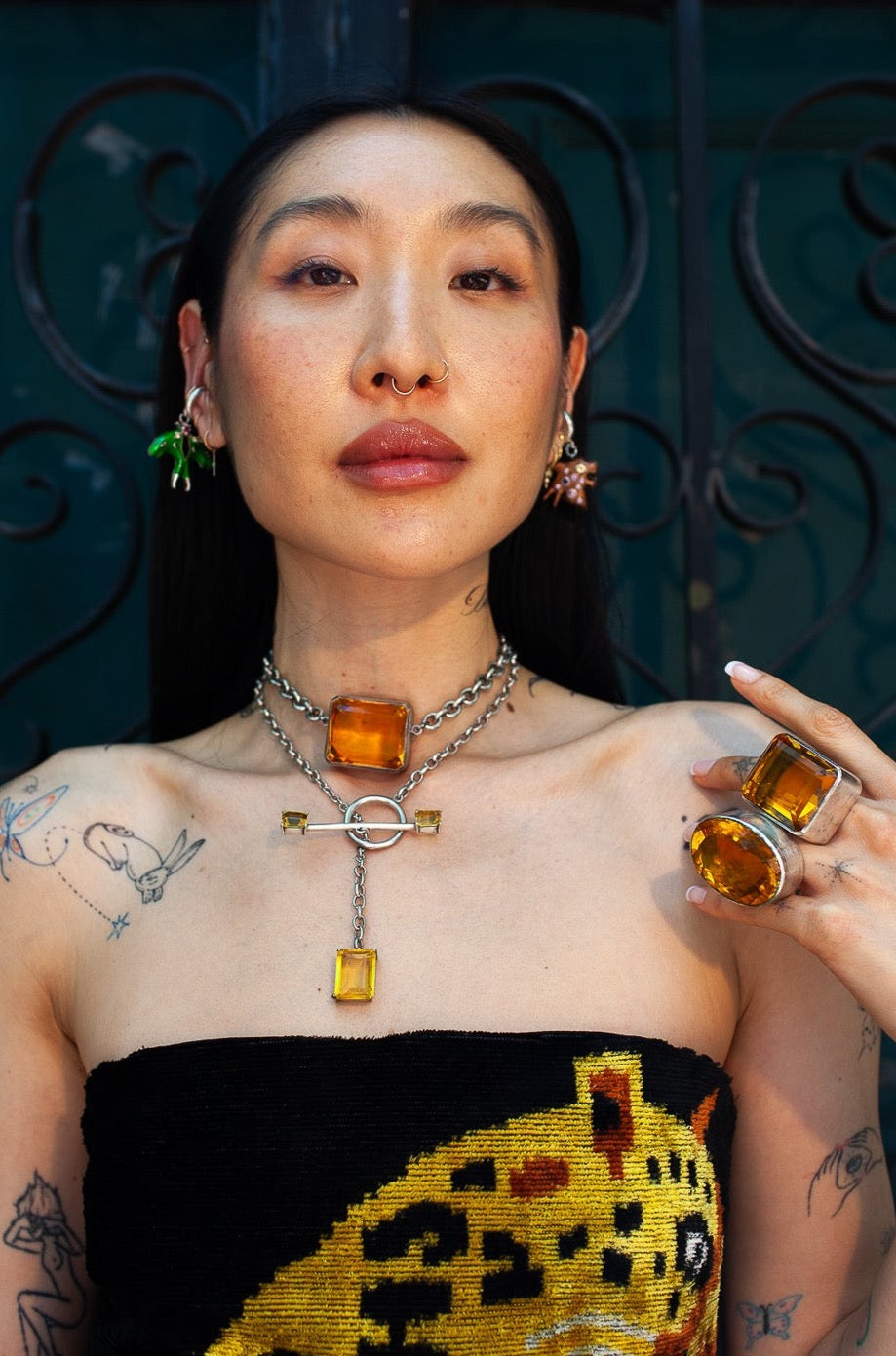 Woman wearing jewelry with a dark background
