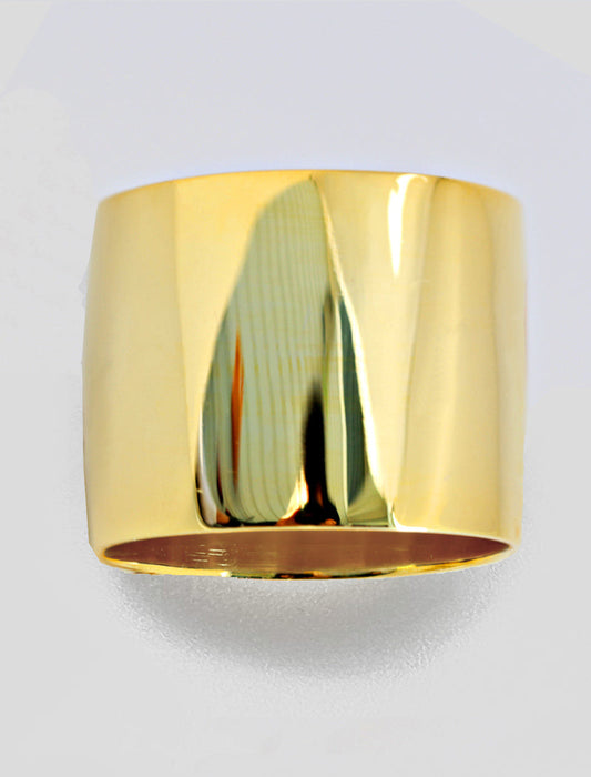 Gold cylindrical object on a light gray background
