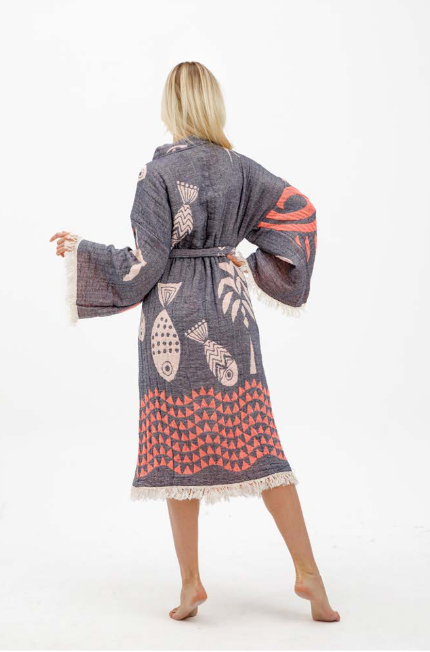 Woman wearing a patterned robe on a white background