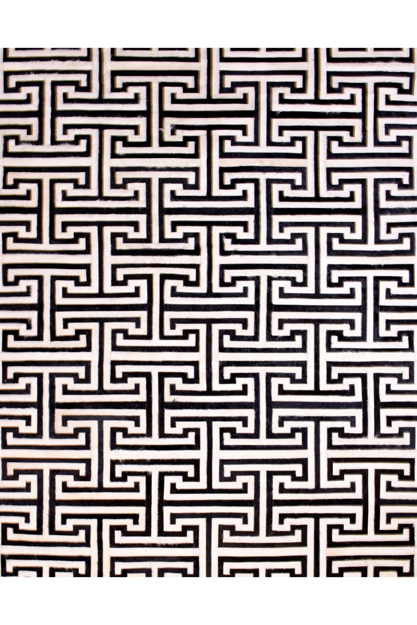 T MODEL – Maze-Inspired Cowhide Patch Rug