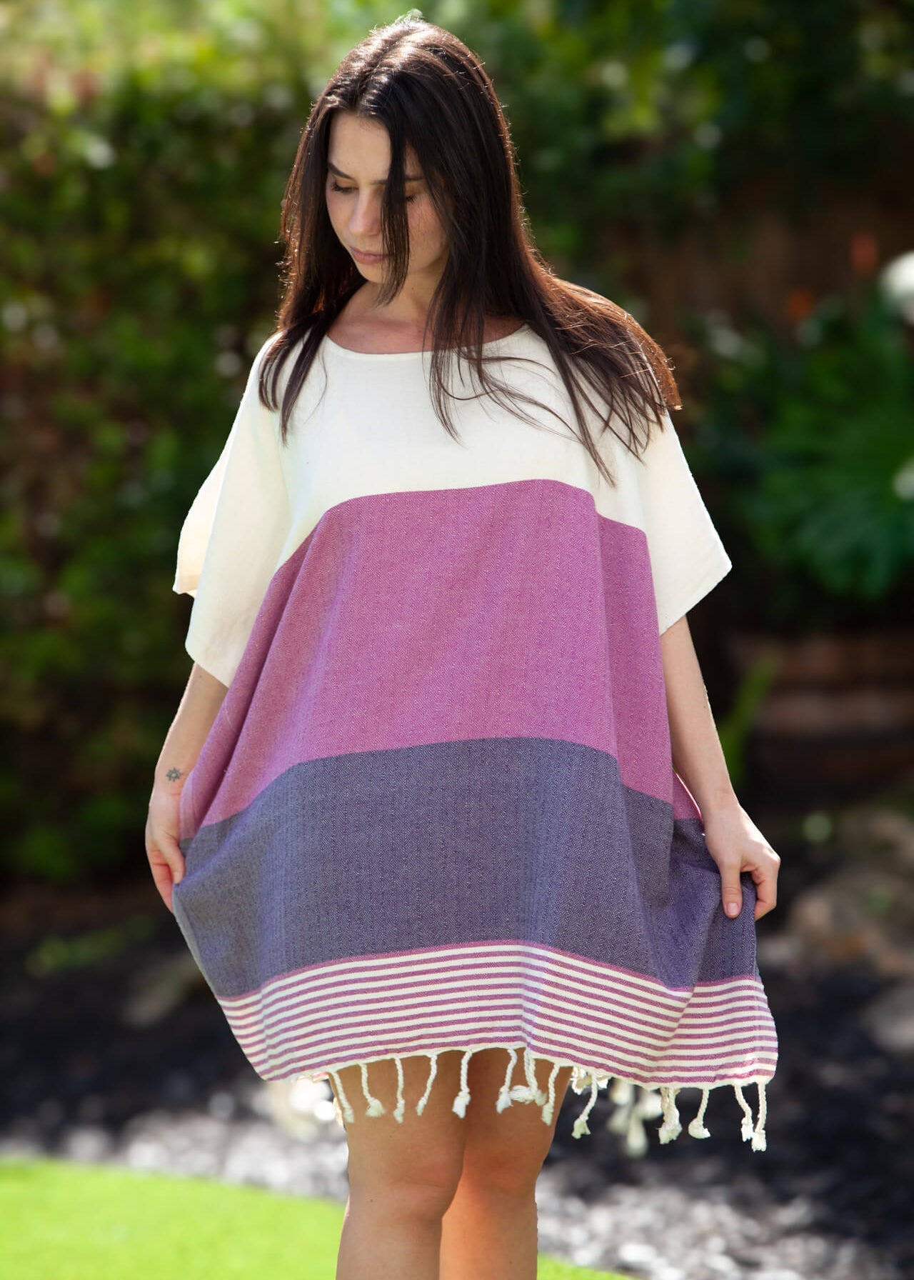 Woman wearing a colorful dress with a white background