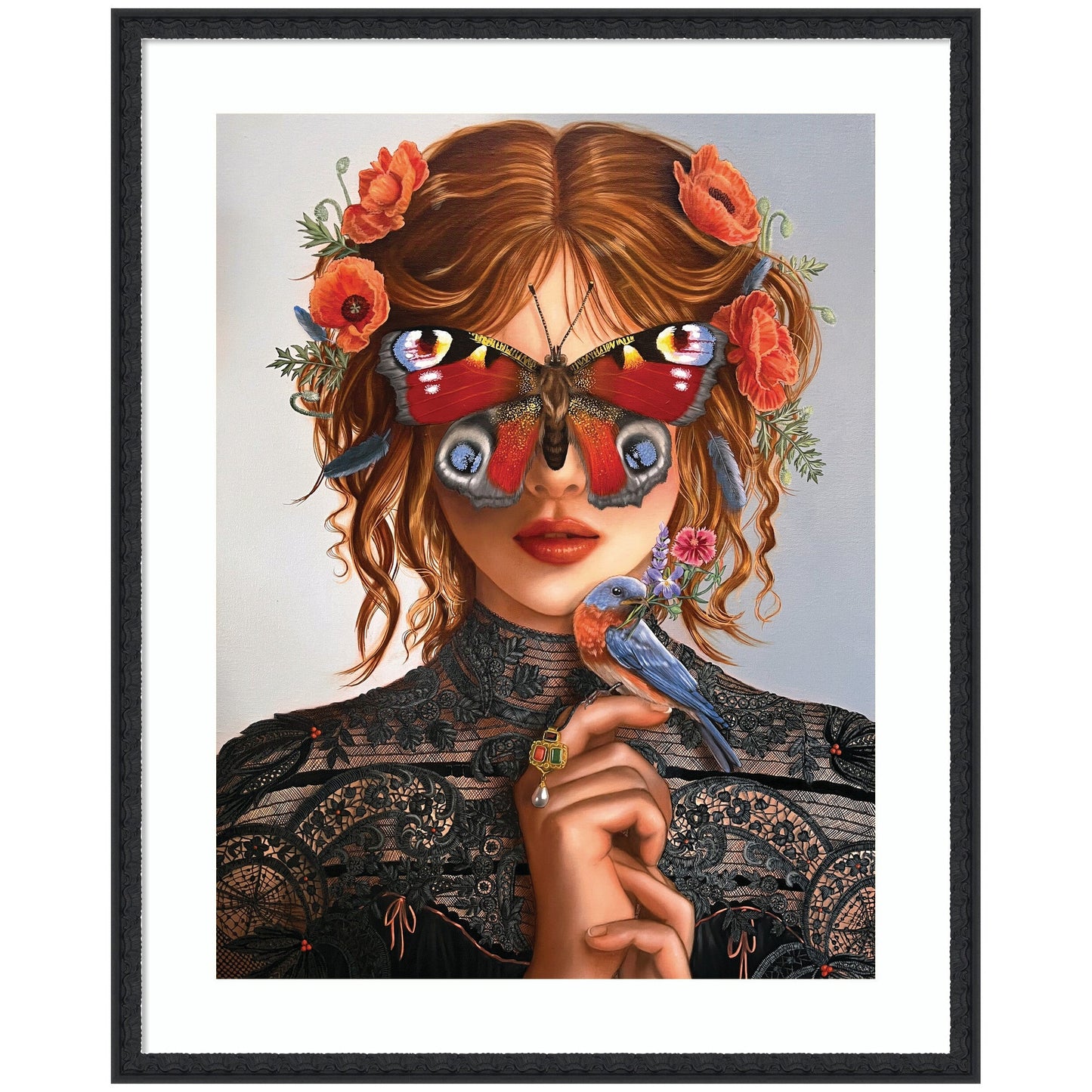 Framed artwork of a woman with butterfly wings and flowers in her hair, holding a bird.