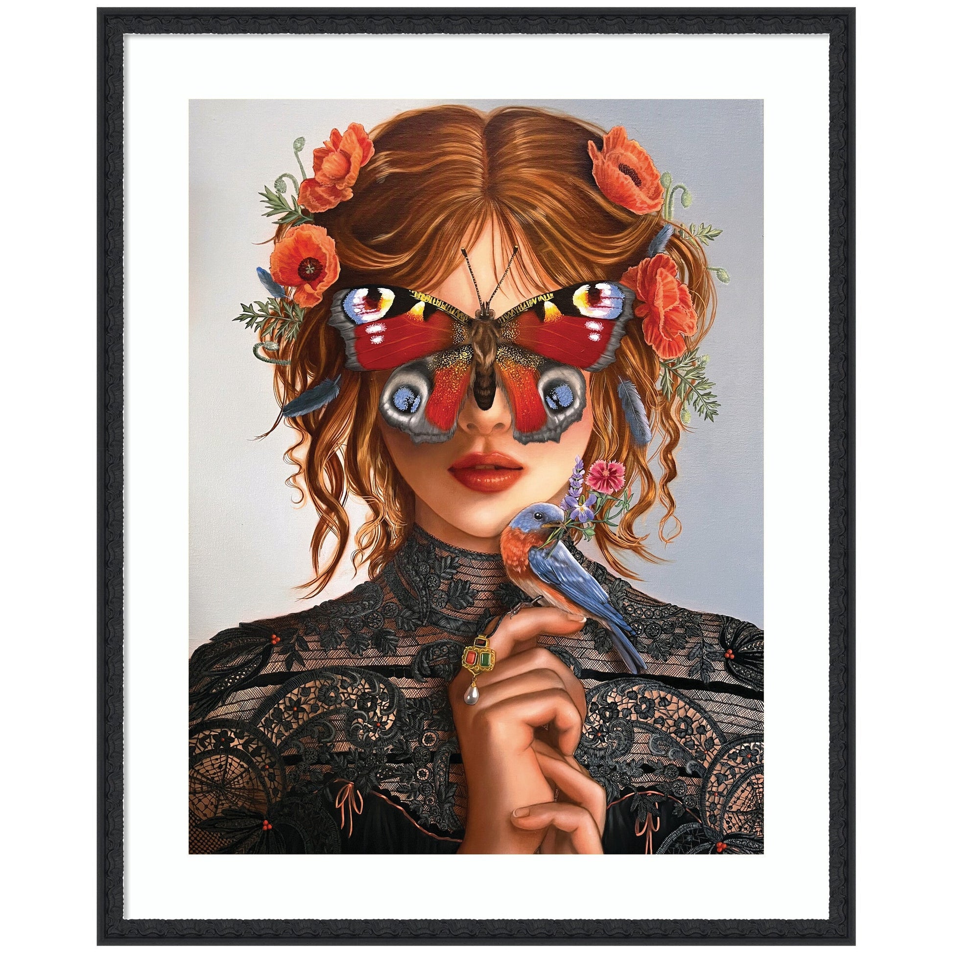 Framed artwork of a woman with butterfly wings and flowers in her hair, holding a bird.