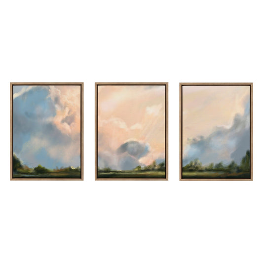 Three framed paintings of a landscape with clouds on a white background
