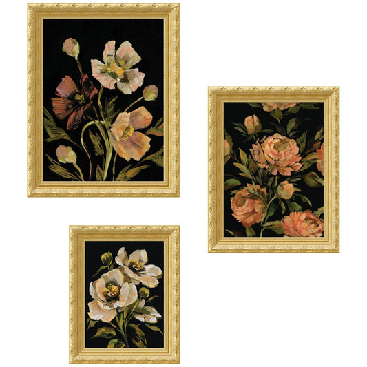 Set of three floral paintings in gold frames on a white background