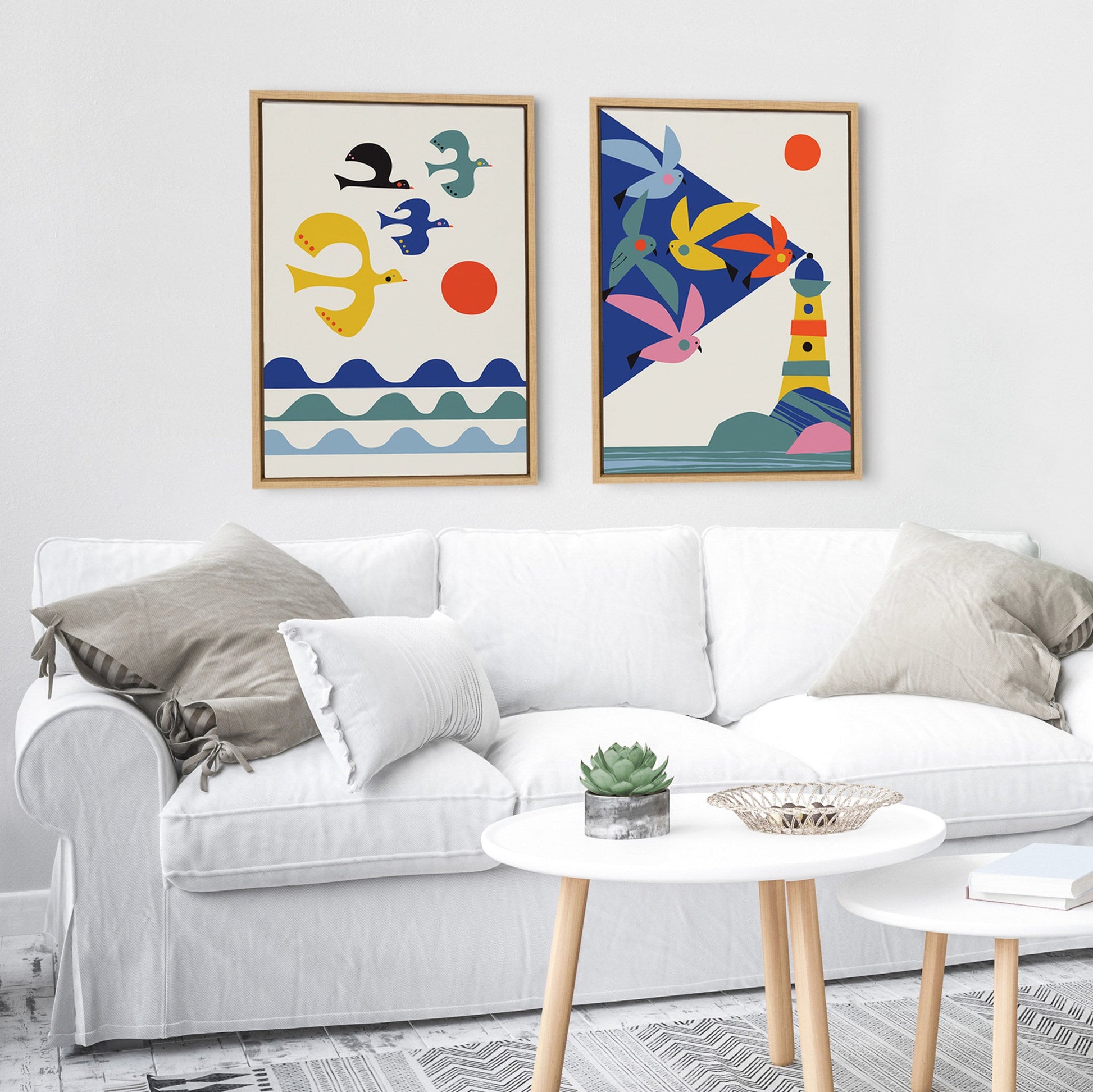 Living room with a white sofa, colorful abstract art on the wall, and a small round table.
