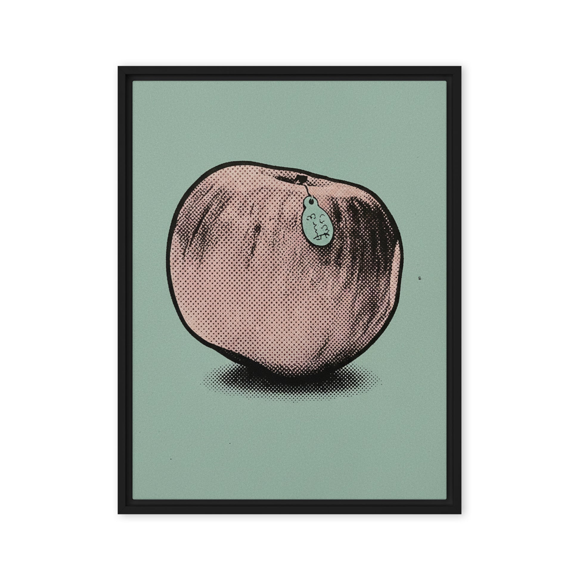 Black framed canvas wall art featuring a retro pop art halftone illustration of a pink peach with a tag, set against a muted sage green background.