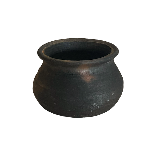 Black clay pot on a white background
