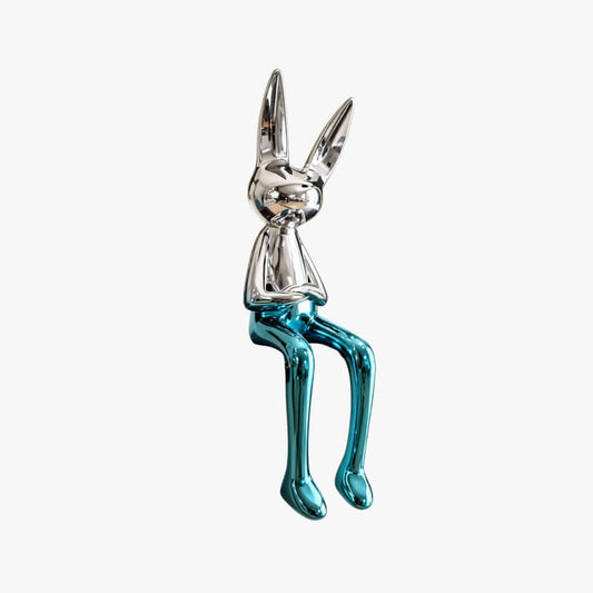 Metallic blue and silver rabbit figurine on a white background